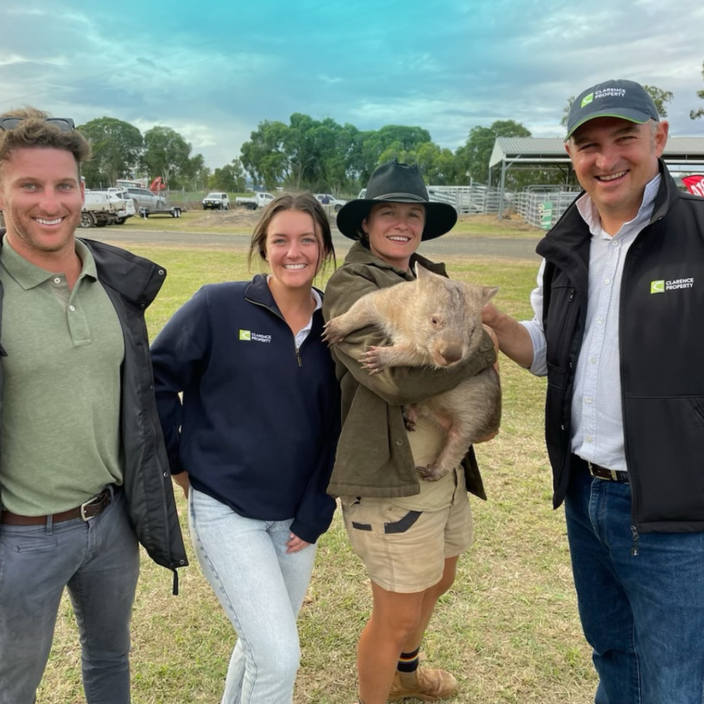 Clarence Property Capital Raising Team pose with Wombat at Primex 2023.